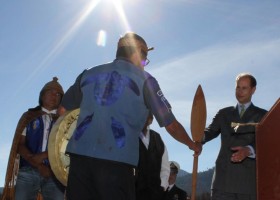 The students of Ditidaht School present Their Highnesses with a paddle through speaker Phillip Edgar.