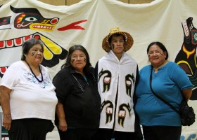 Aunties Margaret, Betty and Ella stand with Clakwakeen, Alex Smith, the newly seated Ha'wilth of Ka-ok (Fair Harbour)