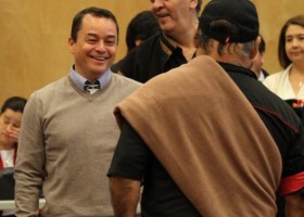 A-in-chut Shawn Atleo shares a laugh with Ray Harris of the Coast Salish as he prepares to stand up the national chief