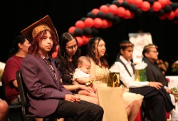 Eli Ginger sits with other Huu-ay-aht graduates on June 7 at ADSS.