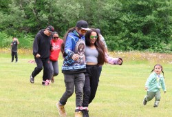 The big kids having fun in a three-legged race.