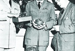 A century after the attack, three cannon balls fired at Ahousaht villages were turned over to the Maritime Museum of B.C. Pictured from the left are Cdr. J. L. Panabaker, commanding officer of the Margaree, Commodore A. G. Boulton, chairman of the board of the Maritime Museum, and Col. J. W. D. Symons, director of the museum.