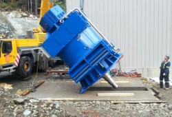 A four-megawatt generator is lifted into the Winchie Creek Hydro powerhouse. The project is completely owned by Tla-o-qui-aht First Nation. (Barkley Project Group photo) 