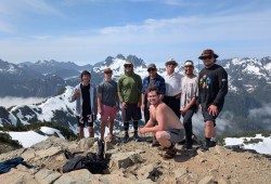 Students stand at the summit of 50-40 after scaling the mountain.