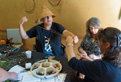 A man who identifies as Bear makes dream catchers during National Indigenous Peoples Day on June 21.