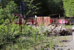 A spur off Carmanah Main now has a set of barricades constructed across the road. The first is made of wood and brambles followed by a more significant structure that appears to be walls made of wood and tarp.