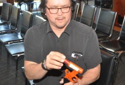 Tseshaht member Boyd Gallic loads a cartridge into an approved marine pyrotechnic device.