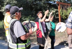 Hupacasath Chief Councillor Brandy Lauder dances while other sing at the logo unveiling.