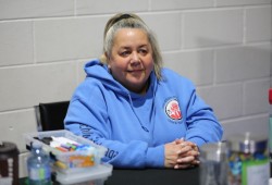 Leah Wrigley, a mental health counsellor with Nuu-chah-nulth Child and Youth Services sits at the department’s information booth in Maht Mahs. Child and Youth Services serves Nuu-chah-nulth-aht aged 0-24, offering things like baby massages, child development services, therapeutic play, youth groups, clinical counselling and developmental assessments.