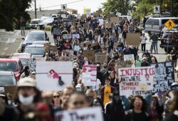 Peaceful protestors from Tofino, Ucluelet and the surrounding Nuh-chah-nulth communities march through the streets of Tofino in honour of Chantel Moore and George Floyd, on Monday.