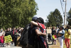 Chantel Quock embraces Dan Wright after he speaks in front of a group of protestors in Ucluelet. "We're in a generation of fads," said Wright. "What that means is in about two weeks from now, we're onto the next black mirror episode. Don't leave us all still standing here alone."