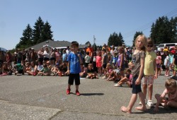 John Howitt students watch the presentation of the school's new logo.