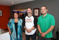 The Tseshaht First Nation has owned Orange Bridge Cannabis, a dispensary located at 7583 Pacific Rim Highway in Port Alberni, for almost two years now. The Nuu-chah-nulth First Nation does not cultivate its own cannabis products, but Orange Bridge Cannabis, however, does sell other Indigenous-produced products. Pictured are Manager Ron Kyle (centre), Assistant Manager Tammy Lucas and Tseshaht Councillor Ken Watts when the store opened in September 2019. (Eric Plummer photo)