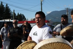 John Gomez leads a song from his family during the gathering.