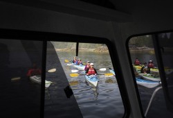 The Tseshaht Beach Keepers ask a group of kayakers what their next stop is as they depart from Hand Island, in the Broken Group Islands.