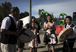 Grade 7 graduates of Haahuupayak Elementary School sing before their graduation ceremony begins.