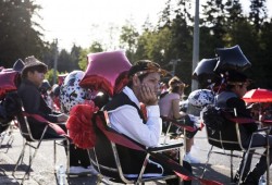 Chance Fred listens to his classmate's graduation speech at their Grade 7 graduation ceremony outside Haahuupayak Elementary School.