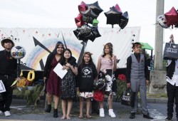 The Haahuupayak Elementary School Grade 7 graduating class poses for photos for their family and friends at the end of the graduation ceremony. 