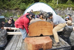 Community members came together to help Joe Martin move a totem pole from where it was carved at the Naa'Waya'Sum Gardens (formerly the Tofino Botanical Gardens) to the Tla-o-qui-aht village of Opitsaht, on Meares Island, on June 29, 2022.