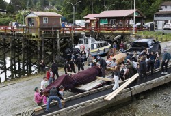 The totem pole is moved from the Naa'Waya'Sum Gardens (formerly the Tofino Botanical Gardens) to the Fourth Street dock in Tofino so it can be barged to the Tla-o-qui-aht village of Opitsaht, on Meares Island, on June 29, 2022.