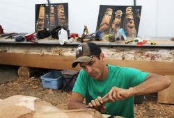 Robin Rorick helps to carve a totem pole at the Tofino Botanical Gardens, on July 9, 2021.