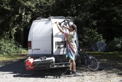 Pierre Dupont packs up his campsite on the side of West Main Forest Service Road, near Tofino, on August 10, 2021. 