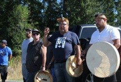 Martin Watts addresses the crowd gathered in front of the DFO office.