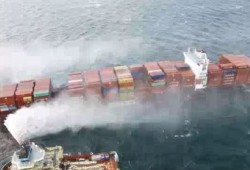 The Canadian Coast Guard responds to a fire on the Zim Kingston, as the ship was anchored south of Victoria on Oct. 21, 2021. (Canadian Coast Guard photo)