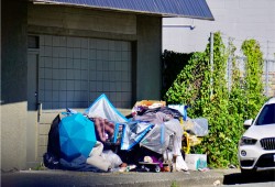 A makeshift shelter was set up outside the Wintergreen apartments on Fourth Avenue last summer. (Karly Blats photo) 