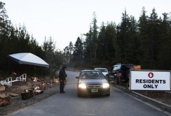 Curtis McGillivary works a shift monitoring the incoming and outgoing traffic in front of Ty-Histanis, on Thursday April 9, 2020. 