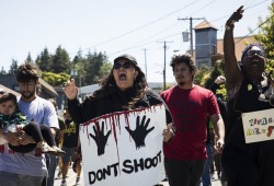 Marissa Mack (centre) organized a peaceful protest in Ucluelet to honour Chantel Moore and George Floyd, on Sunday, June 6, 2020. “I had no relationship to her other than the colour of our skin,” said Mack. “All lives don’t matter until black and brown lives matter.” (Photograph by Melissa Renwick)