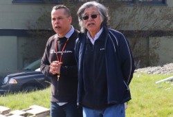 Alberni Indian Residential School survivor Wally Samuel speaks at the celebration, next to Haahuupayak teacher Trevor Little. (Holly Stocking photo)