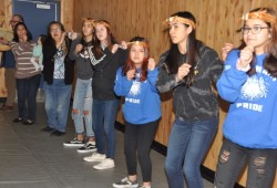 Members of the Tseshaht Pride Girls Basketball team perform the Dinner Song to kick off the lunch break.