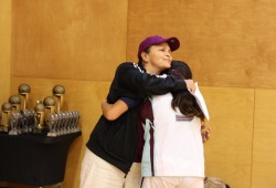Anita Charleson-Touchie hugs a Raven player during the awards on Oct. 25.