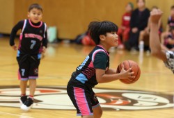 Tla-o-qui-aht U10 player Carlito Thomas takes a shot.