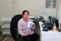 With the help of a Cricket printer, Corinne Martin sets about making little flags for the dancers with Tla-o-qui-aht’s logo.