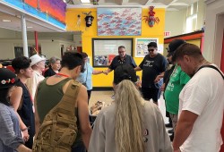 A prayer is offered before volunteers hit the pavement for a weekly lunch drop