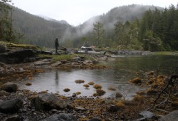 Darrell Williams stands by the remains of a fish trap at Valdez Bay in Nootka Sound, a fishing technique used by his Mowachaht ancestors that incorporated the changing tides. (Eric Plummer photo)