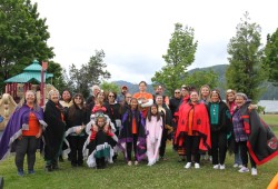 The Hupacasath dancers stand together in their shawls with warm smiles, eagerly awaiting their performance at the Harbour Quay on June 9. 