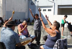 Nuu-chah-nulth-aht sing outside Port Alberni’s overdose prevention site. New standards for the sites stress the need to support “priority populations”.