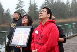 Patrick Lucas and family watch balloons float above the Victoria Quay in Port Alberni in March 2022 during a vigil for his late son. 