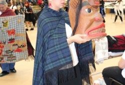 Following the naming ceremony, Huu-ay-aht women danced onto the floor, each carrying an item from Yał luu a’s hupakwanim – his treasures used to conduct his chiefly duties. They were placed on tables, prominently displayed.