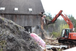 Two of the heavy equipment operators were former Christie students. Bruce Lucas of Hesquiaht and Wilfred Atleo of Ahousaht each ran excavators, tearing down sections of the gym. They were cheered on by the crowd when they exited their machines.