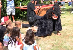 The bear standing at the bottom of the pole represents a dance performed when young people reached the age of puberty.