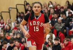 Jaidin Knighton runs up the court during the game against Pacific Christian School.