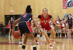 Kura Rorick defends against a Pacific Christian player. 