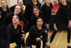 The ADSS dance team performed for the packed gym during breaks in play. 