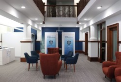 Nanaimo’s Indigenous Justice Centre cozy living room space, decorated with wallpaper designed by Snuneymuxw First Nation artist, Eliot White-Hill.