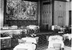 In 1939 McDonald was commissioned by Hotel Vancouver to paint a mural on the dining room wall. The mural was a scene from Yuquot featuring a house with a woman and child standing in front. They are surrounded by totem poles, forests and mountains. Jutting from the tree tops in the background, is a church steeple.  Sadly, this mural no longer exists, likely destroyed during renovations.