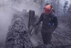 A firefighter with the BC Wildfire Service works to extinguish a blaze on Mount Underwood in August 2025. The rapid spread of the fire was caused by “a combination of extreme drought conditions, dry weather systems, steep slopes and fuel loading in the form of slash,” according to the BC Wildfire Service. (BC Wildfire Service photo)